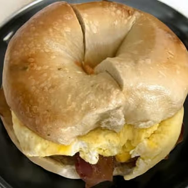 Breakfast meat on a bagel.